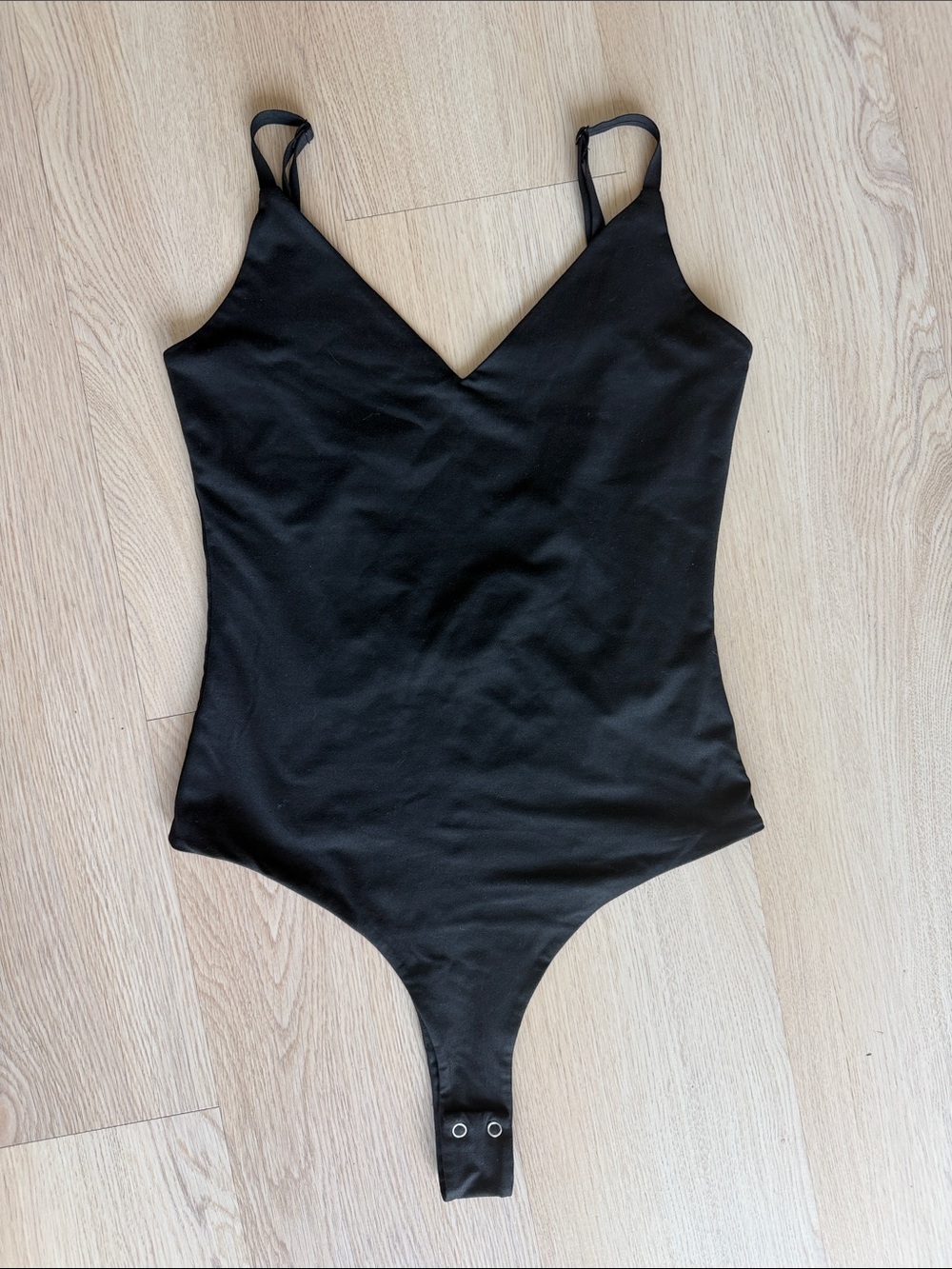 Black V-Neck One-Piece Bodysuit for